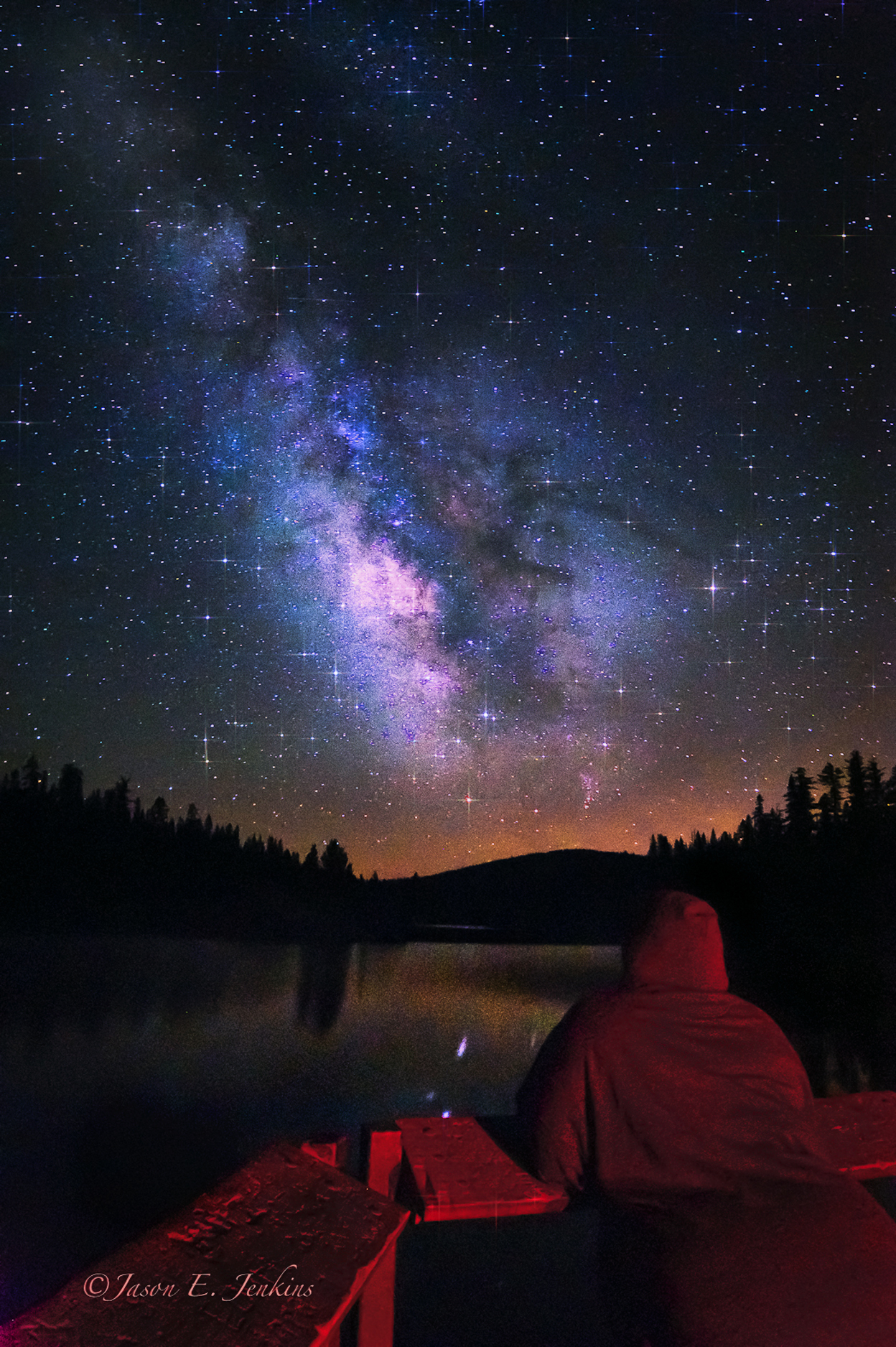 On a clear night in the high Sierra two friends set out on a lake a mile above sea level to watch the stars. They found the universe gazing back at them. I was lucky to grab this image of a great friend of mine gazing at the Milky Way. I think we both wer