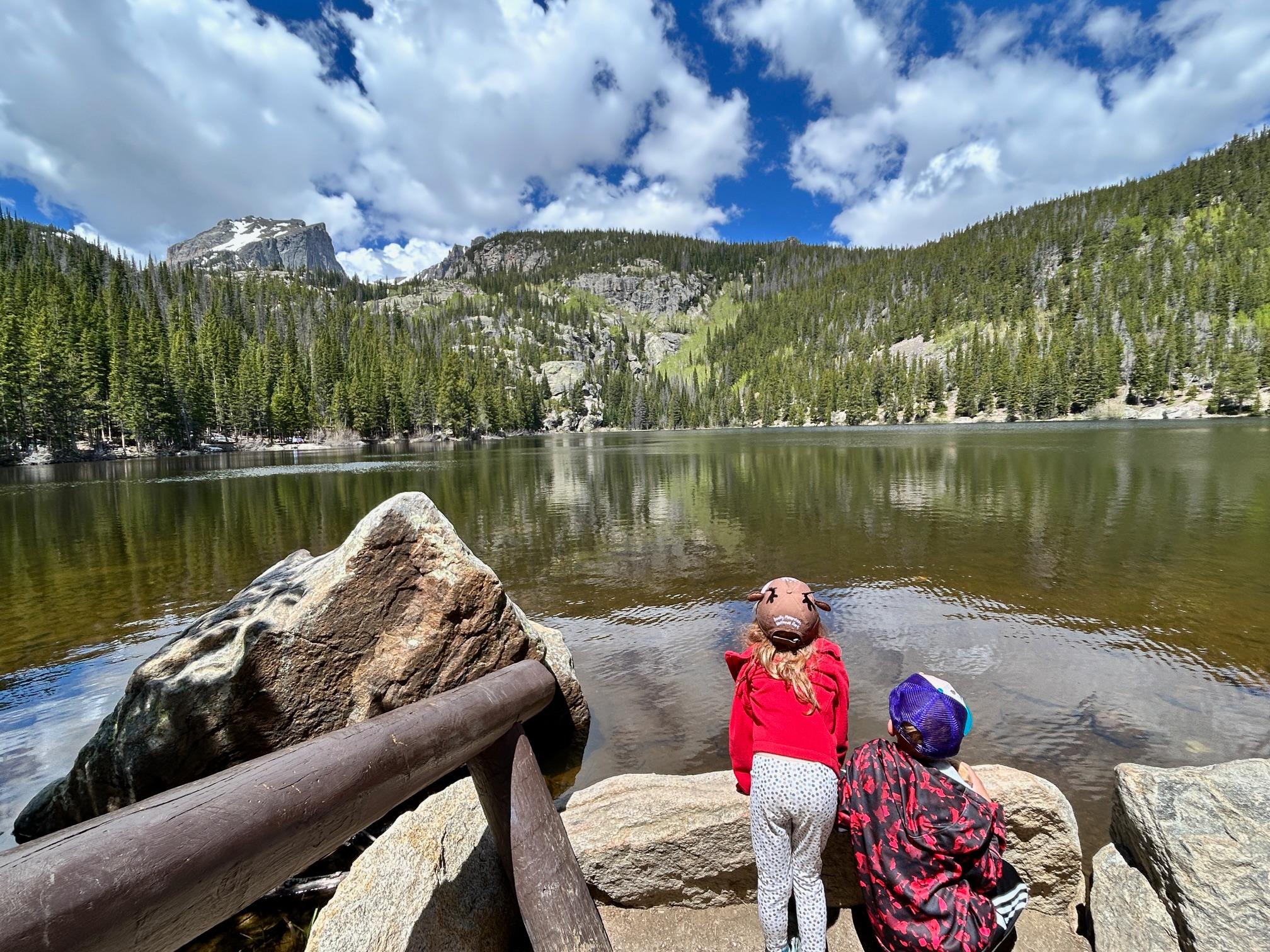 Two junior rangers are gazing at Bear Lake in late spring/early summer