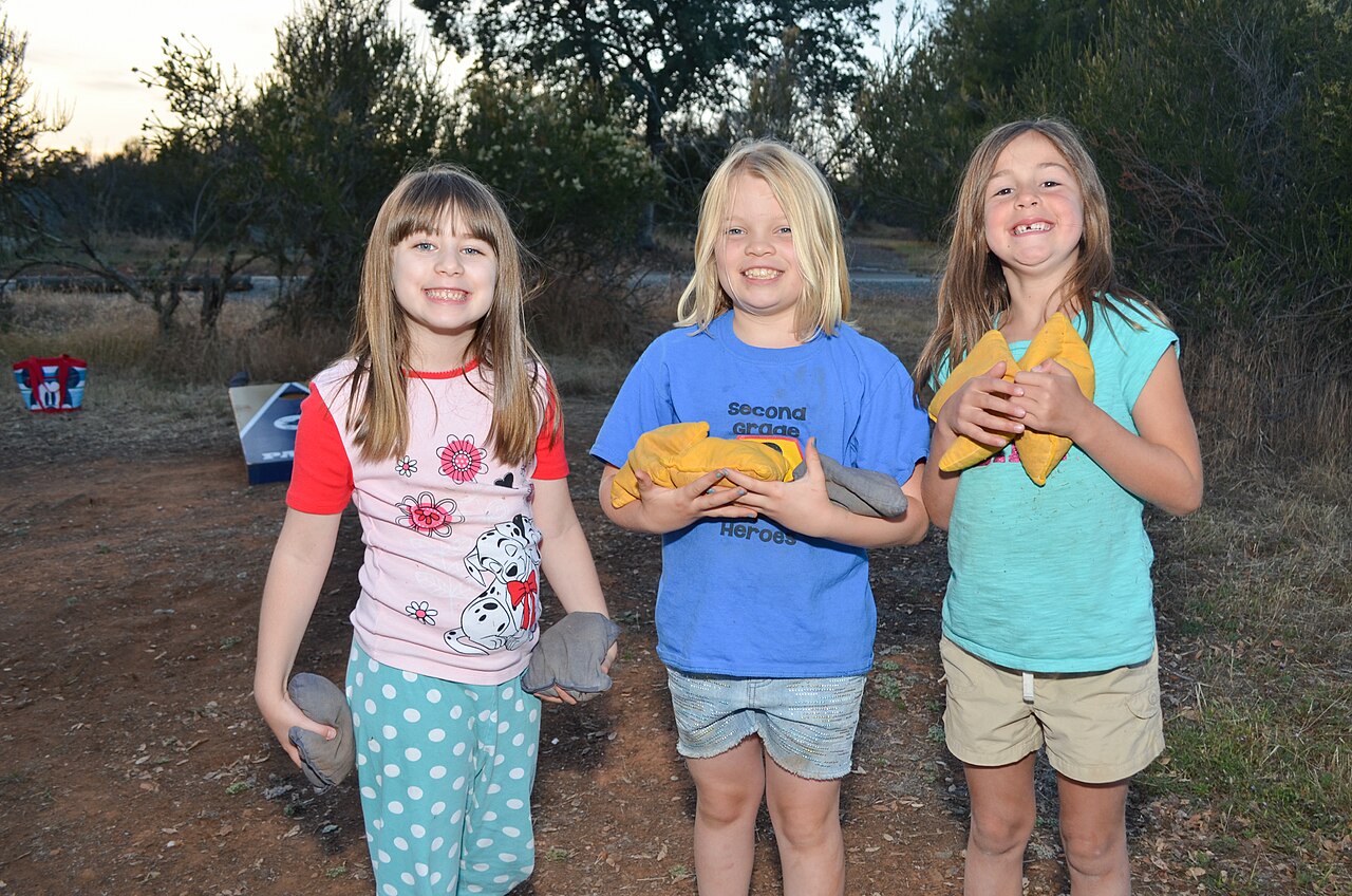 Daughters of U.S. Army Corps of Engineers Sacramento District employees take a break from tossing cornhole bean bags during the third district campout May 15-17, 2015 at New Hogan Lake in Valley Springs, California. The event was a chance to get together