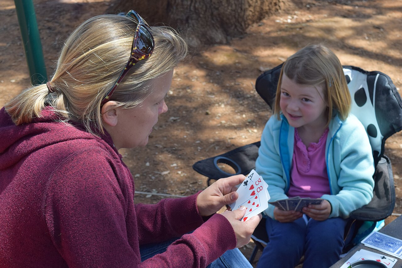 Heidi Burns plays cards with her daughter Izzy during the U.S. Army Corps of Engineers Sacramento District's third district campout May 15-17, 2015 at New Hogan Lake in Valley Springs, California. The event was a chance for employees, families and their g