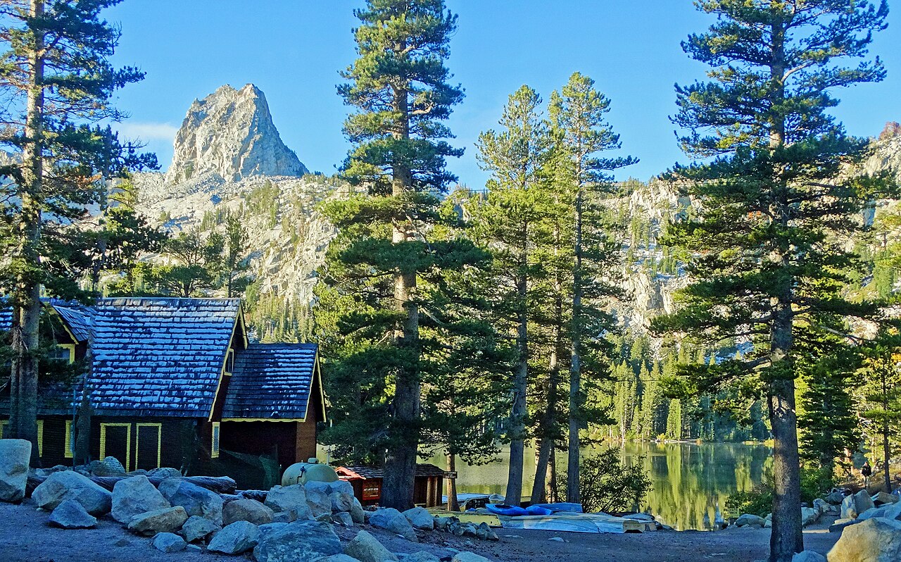 Lake George, one of the many Mammoth Lakes in the Sierra Nevada. The colored leaves had dropped and I found snow on the roof of this cabin. 

The new sun was just coming through the trees and burning off the mist over the lake which was reflecting the for