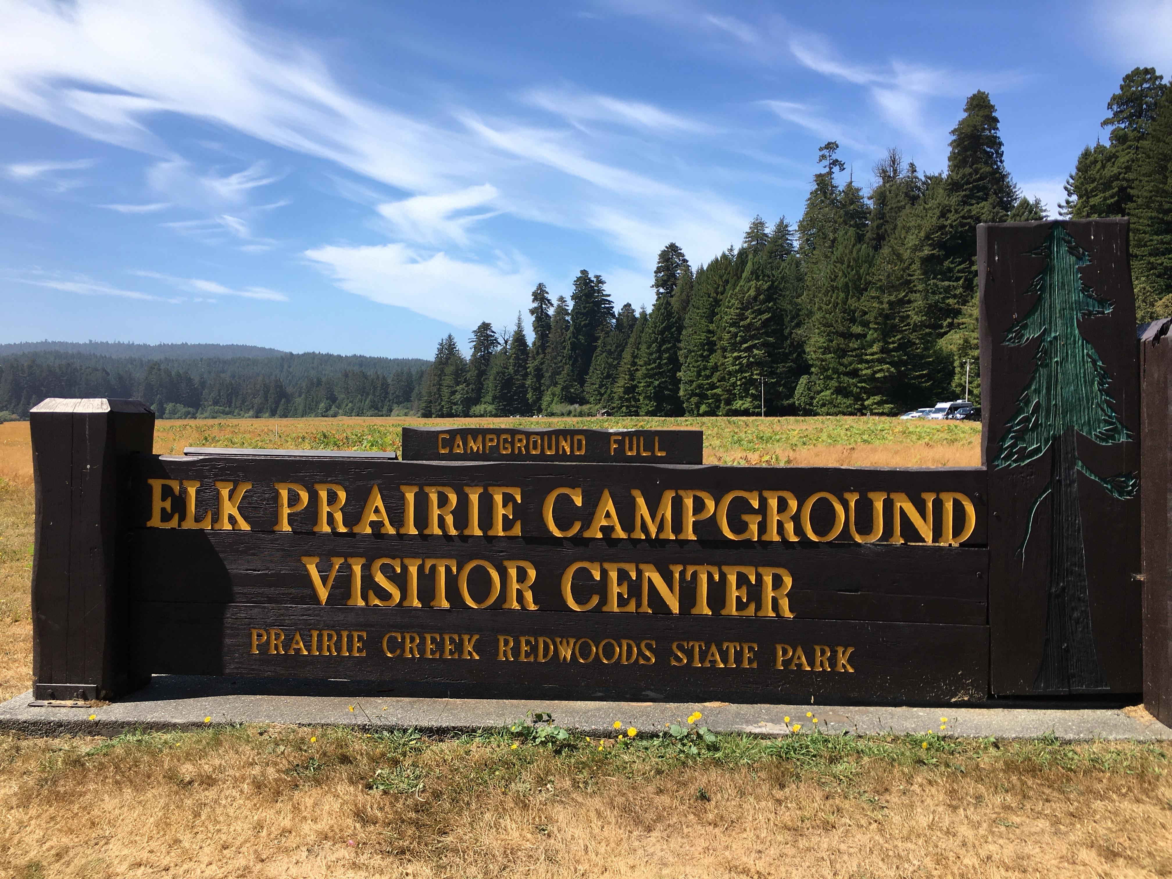 Brown and yellow park sign.
