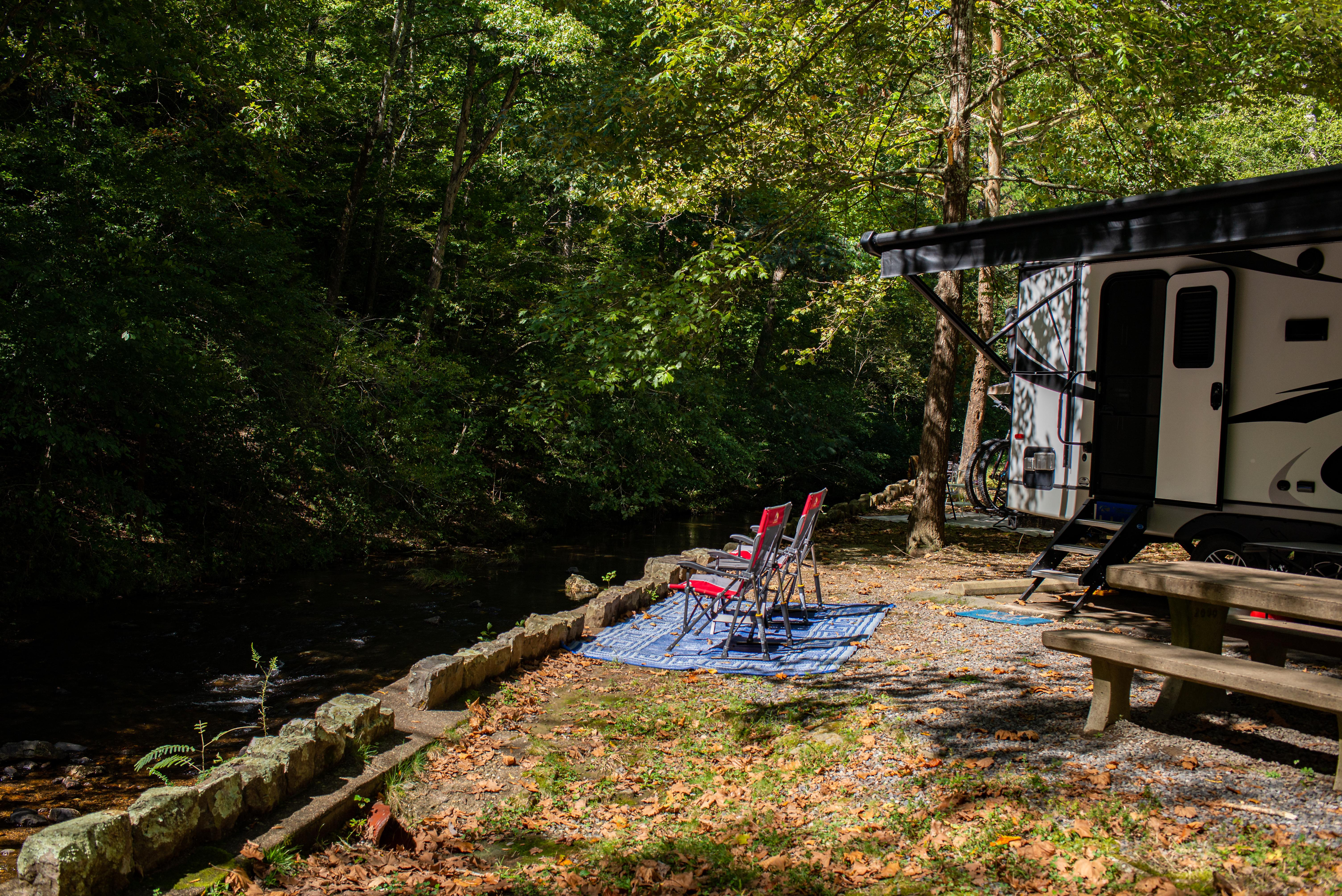 Lawn chairs beside a creek at Gulpha Gorge Campground in Hot Springs National Park