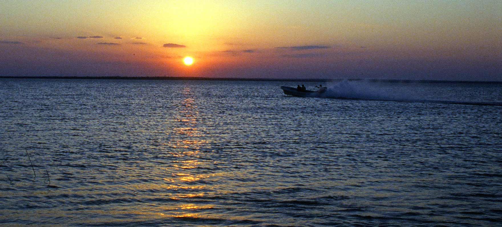 Boat on the Lake at Sunset